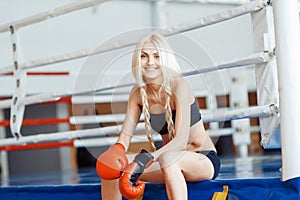 Pretty sport woman with boxing gloves