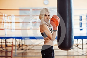 Pretty sport woman with boxing gloves