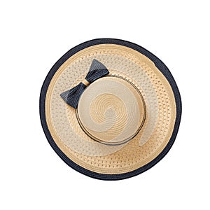 Pretty straw hat with ribbon and bow on white background. Beach hat top view isolated