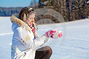 Pretty student girl with snow in palms