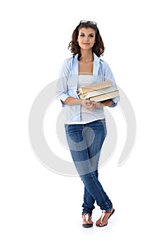 Pretty student holding books