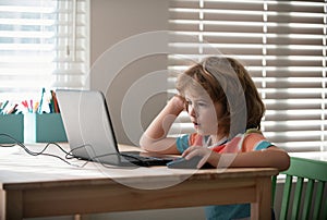 Pretty stylish schoolkid studying homework math during lesson at classroom, education concept, Cute schooler.