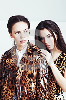 Pretty stylish woman in fashion dress with leopard print together in luxury rich room interior, lifestyle people concept