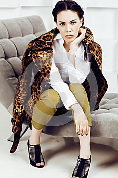 Pretty stylish woman in fashion dress with leopard print together in luxury rich room interior, lifestyle people concept