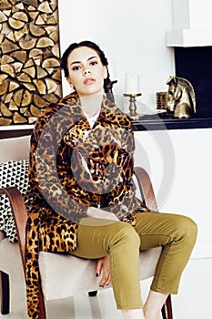 Pretty stylish woman in fashion dress with leopard print together in luxury rich room interior, lifestyle people concept