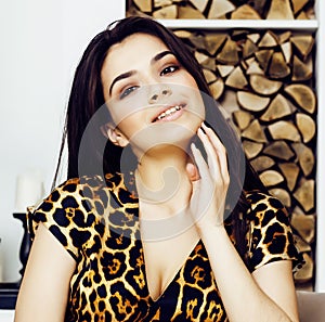 Pretty stylish woman in fashion dress with leopard print together in luxury rich room interior, lifestyle people concept