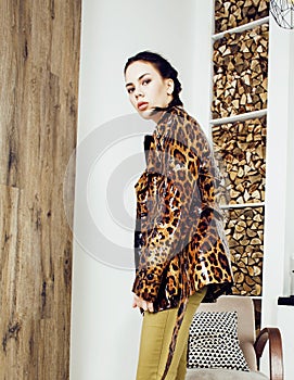 Pretty stylish woman in fashion dress with leopard print together in luxury rich room interior, lifestyle people concept