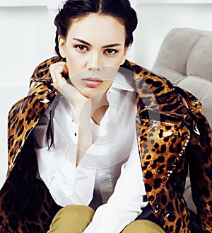 Pretty stylish woman in fashion dress with leopard print together in luxury rich room interior, lifestyle people concept