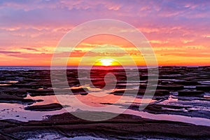 Pretty sunrise over the ocean and beach