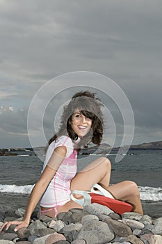 Pretty surfer girl waiting for waves