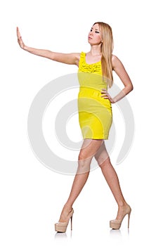 Pretty tall woman in short yellow dress isolated