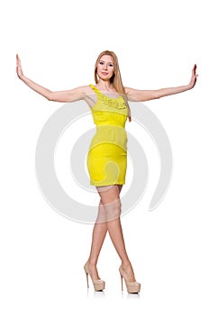 Pretty tall woman in short yellow dress isolated