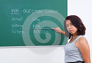Pretty teacher teaching question words