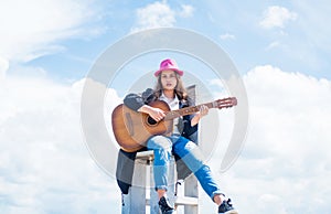 pretty teen girl with acoustic guitar, guitarist