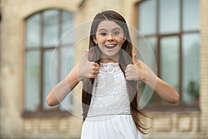 pretty teen girl. adorable girl fashion model. portrait of teenager girl outdoor. thumb up