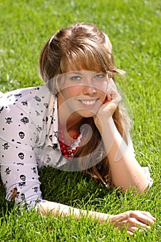 Pretty teen girl on grass