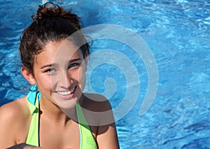 Pretty teen girl in a pool