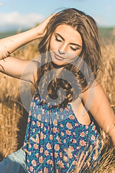 Pretty teen girl in rye field back view