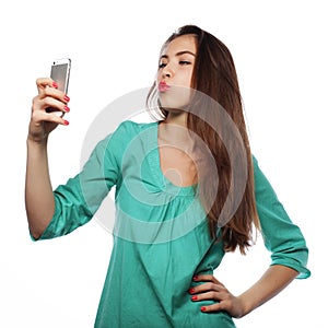Pretty teen girl taking selfies