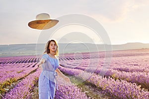 Pretty teen girl walking in lavender field