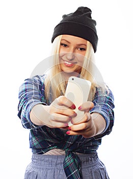 Pretty teen girl wearing hat, taking selfies