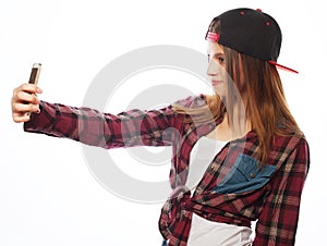 Pretty teen girl wearing hat, taking selfies