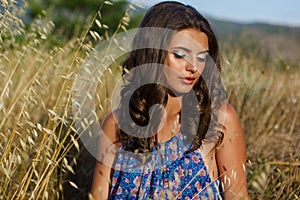 Pretty teen girl in yellow autumn field