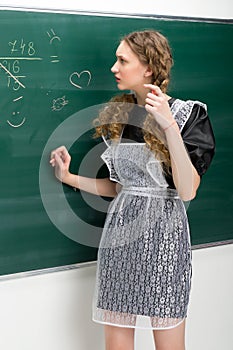 Pretty teen school girl with pensive face expression