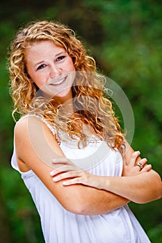 Pretty Teenage Girl Curly Hair Arms Crossed