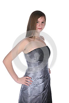 Pretty teenage girl in gray strapless formal gown photo