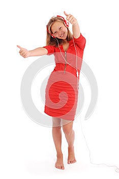 Pretty teenage girl listening music on her headphones