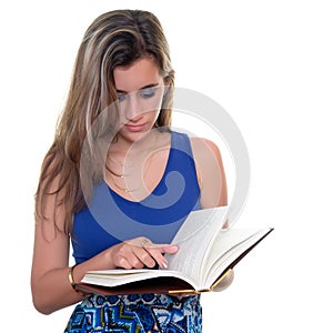 Pretty teenage girl reading a book isolated on white