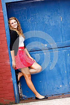 Pretty Teenage Girl Red Skirt Blue Door