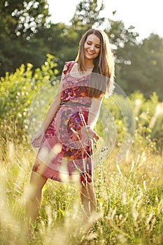 Pretty teenage girl in the summer park