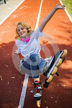 Pretty Teenage Girl Wearing Roller Skaters On The Road In Summe Park.