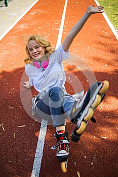 Pretty Teenage Girl Wearing Roller Skaters On The Road In Summe Park.