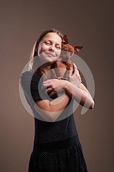 Pretty teenager girl with little doggy