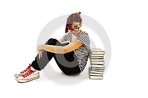Pretty teenager girl sit on floor and reading book