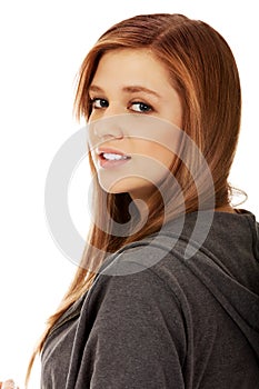 Pretty teenager girl smiling in cheerful mood