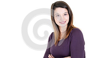 Pretty teenager posing smiling with folded arms crossed and white blank copy space