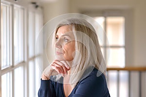 Pretty thoughtful woman with serious expression