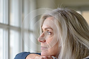 Pretty thoughtful woman with serious expression