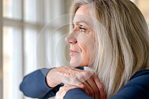 Pretty thoughtful woman with serious expression photo