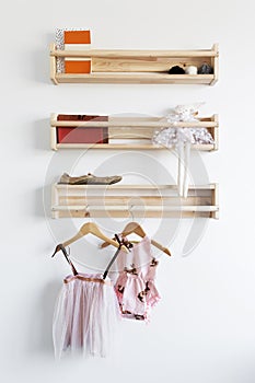 Pretty toys shelf storage in a young girl`s bedroom