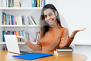 Pretty turkish female student at computer