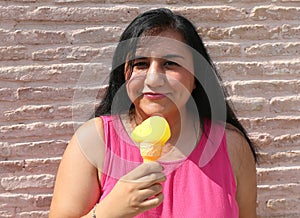 Pretty Turkish Woman holding a Ice Cream cone