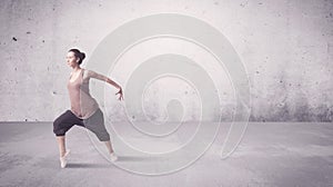 Pretty urban dancer with empty background