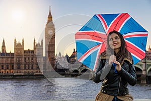 Pretty urban tourist woman explores London during travel