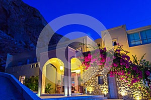 Pretty vacation villa at dawn in Kamari village Santorini Greece