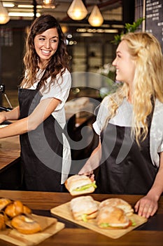 Pretty waitresses behind the counter working
